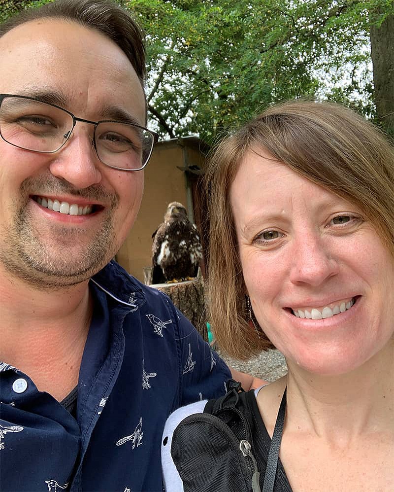 Selfie of Story and Richard, taken in front of an eagle at ‘The Raptors’ in Duncan, BC